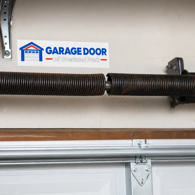 Garage door torsion spring with a visible separation in the coil